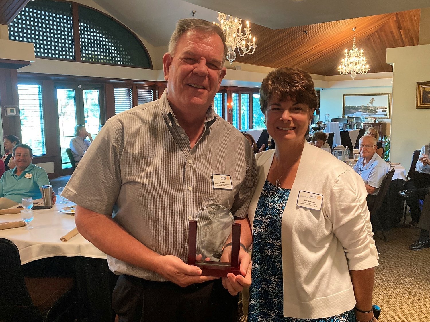 Rotary Club of Ponte Vedra Beach President Lori Anderson, right, congratulates Ed Dalton on his award from Rotary District 6970. Dalton recently received the award for his services as webmaster for both the district and the Ponte Vedra Beach club.